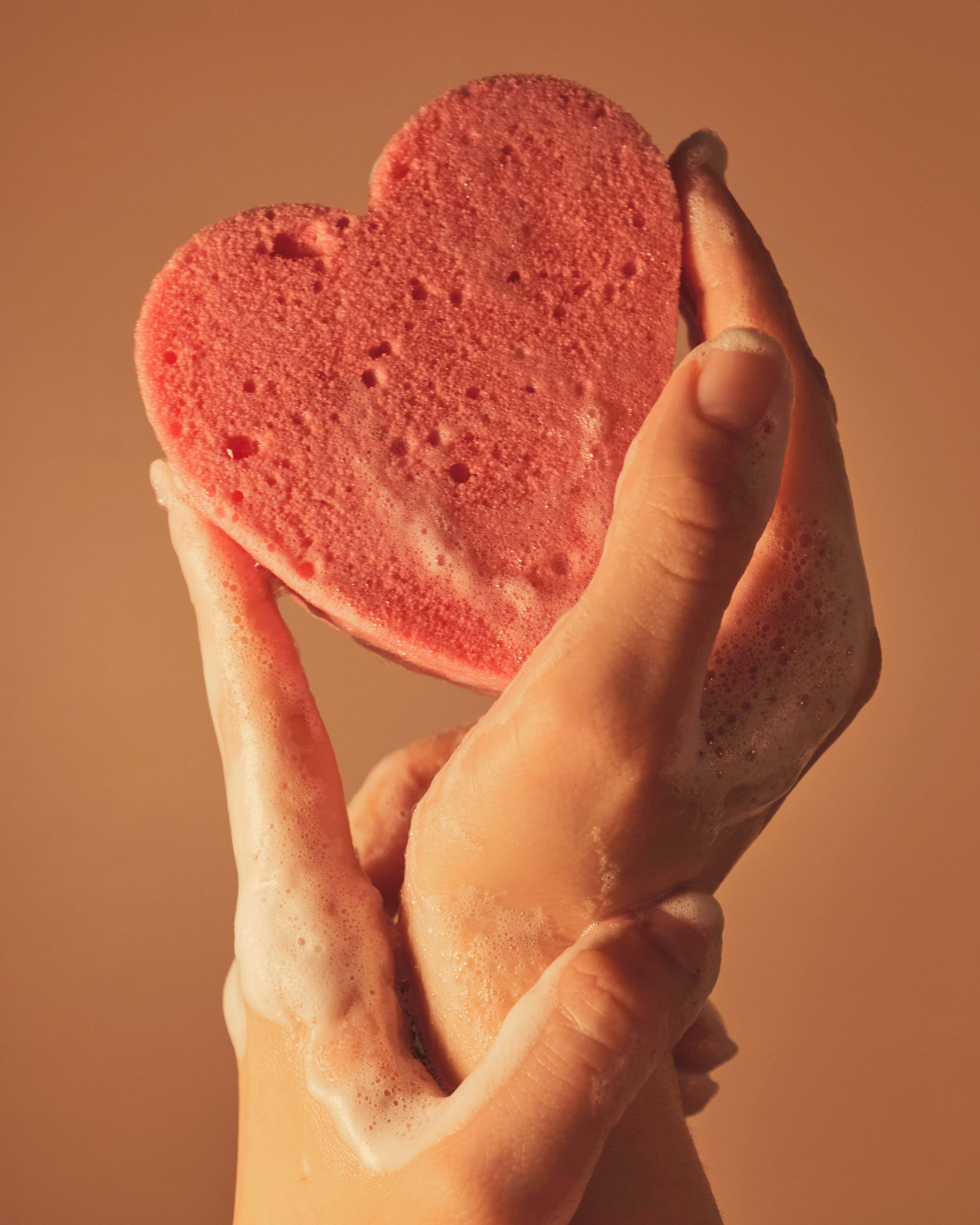 Soap Bubble Person Holding Pink Heart Shaped Cake Showering Image Free
